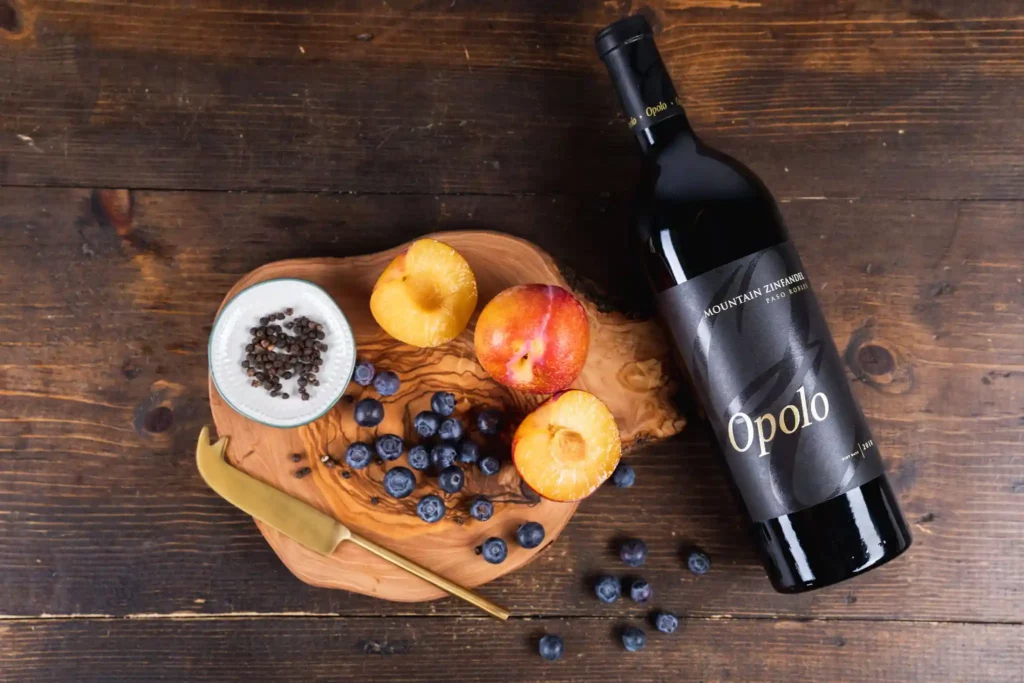 Bottle of Opolo Mountain Zinfandel next to a plate of fruit